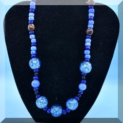 J25. Blue glass and wooden beaded necklace 20” - $14